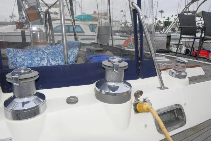 Slide: The Image of Deck view of 2006 Tayana 58 Deck Salon sailboat with winches and seating area. - 69