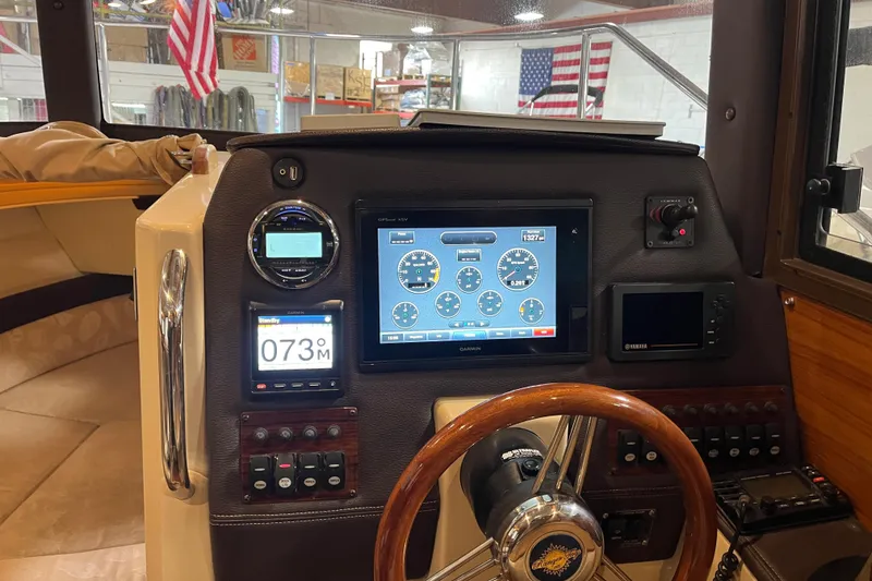 Slide: The Image of 2017 Ranger Tugs R-23 helm with Garmin navigation and control panel. - 12