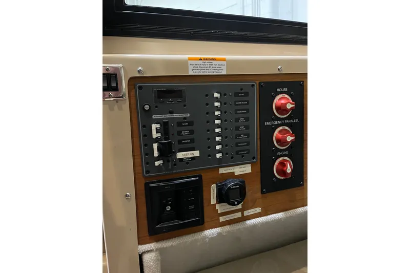 Slide: The Image of Electrical control panel of a 2017 Ranger Tugs R-23 boat, featuring switches and dials. - 22