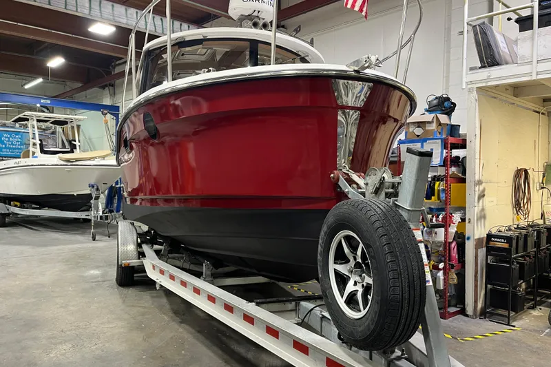Slide: The Image of 2017 Ranger Tugs R-23 boat on trailer in indoor storage facility. - 3