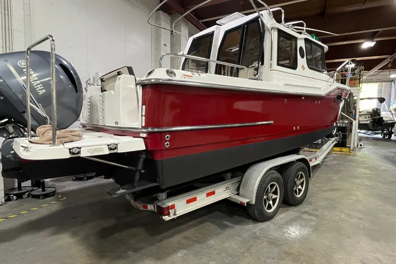 Slide: The Image of 2017 Ranger Tugs R-23 boat on trailer in indoor storage facility. - 7