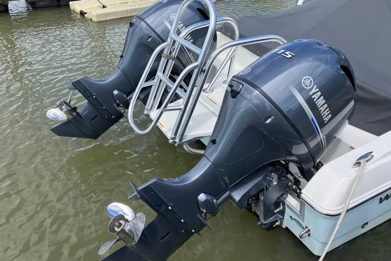 Slide: The Image of Twin Yamaha outboard motors on a 2022 World Cat 230 DC boat. - 10