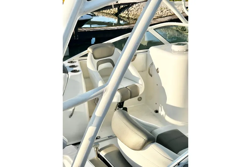 Slide: The Image of Interior of 2022 World Cat 230 DC boat with comfortable seating and sleek design. - 14