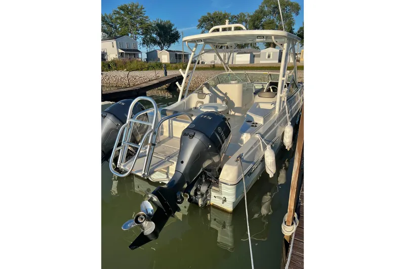 Slide: The Image of 2022 World Cat 230 DC boat docked with dual Yamaha outboard engines. - 4