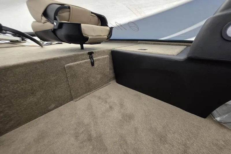 Slide: The Image of Interior of 2026 Tracker Bass Tracker Classic Limited boat with steering wheel and seat. - 10