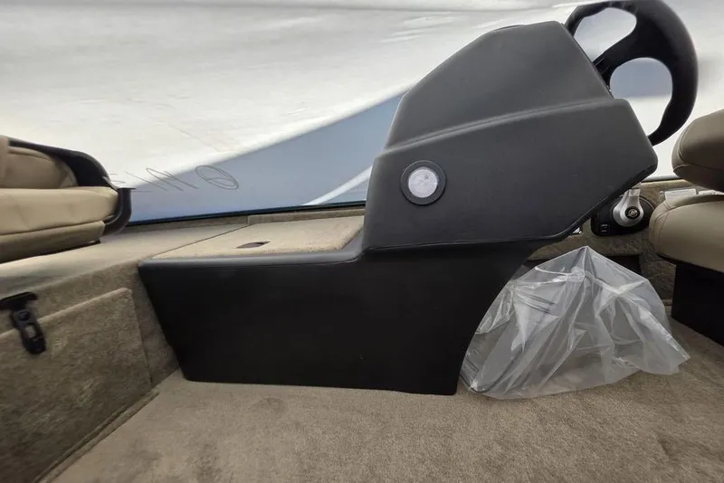 Slide: The Image of Interior of 2026 Tracker Bass Tracker Classic Limited boat with steering wheel and seat. - 13