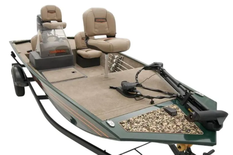 Slide: The Image of 2026 Tracker Bass Tracker Classic Limited boat covered, on trailer, beside metal building. - 5