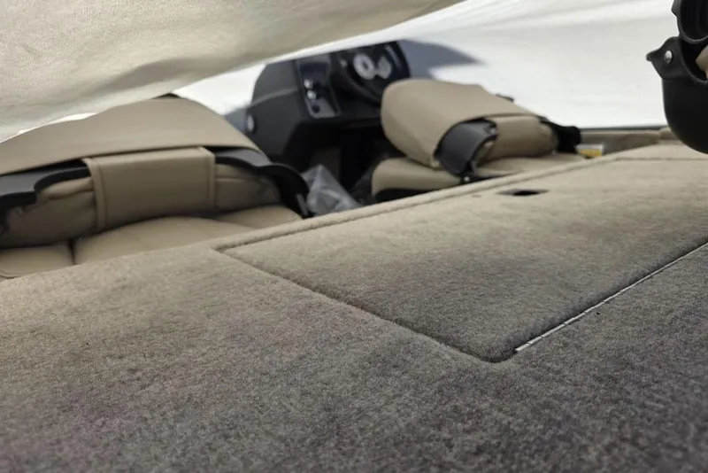 Slide: The Image of 2026 Tracker Bass Tracker Classic Limited boat interior with camouflage detail and carpeted deck. - 6