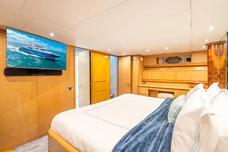 Slide: The Image of Luxurious Maiora Planning 1991 yacht bedroom with modern decor and wall-mounted TV. - 12