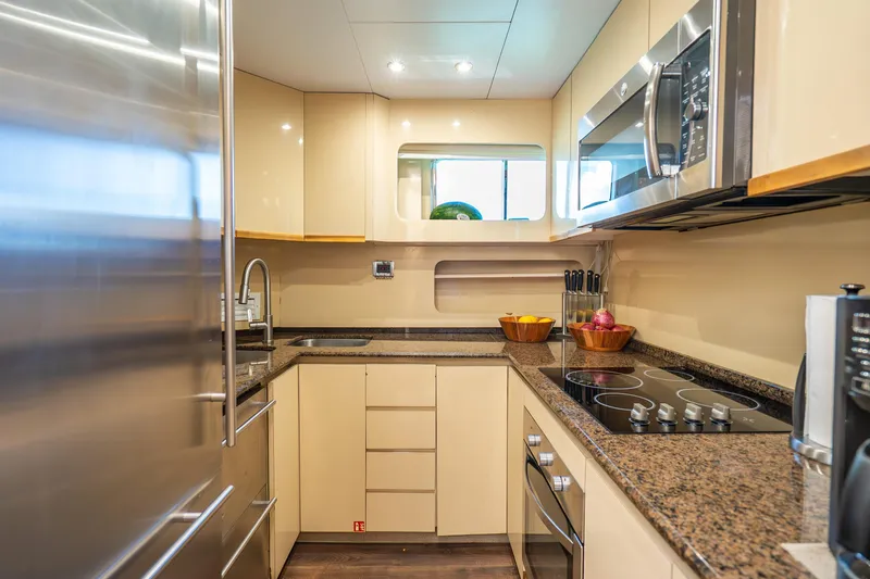 Slide: The Image of Modern yacht kitchen with sleek appliances, granite countertops, and ample storage, Maiora Planning 1991. - 19