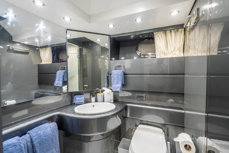 Slide: The Image of Luxurious yacht bathroom with modern fixtures, blue towels, and elegant lighting, Maiora Planning 1991. - 20