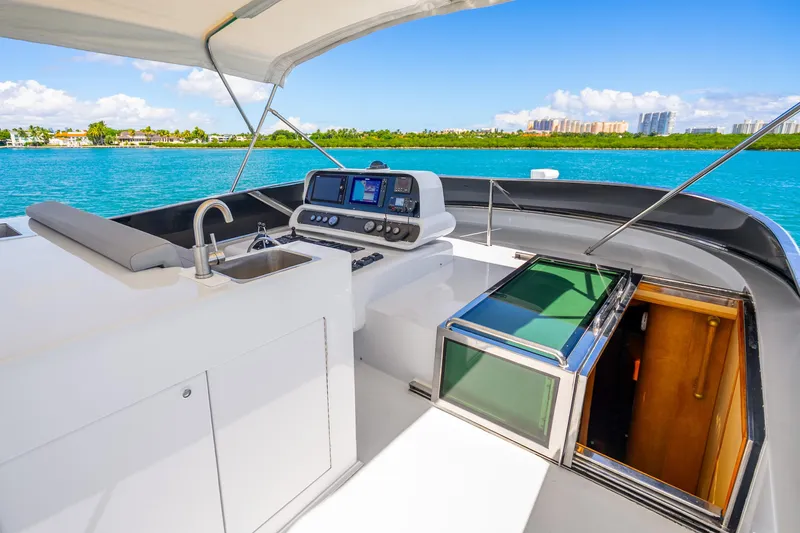 Slide: The Image of Luxury Maiora Planning yacht deck with navigation controls, sink, and ocean view, 1991 model. - 21