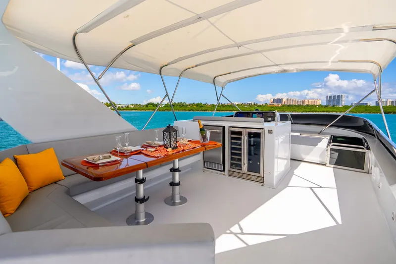 Slide: The Image of Luxurious 1991 Maiora Planning yacht deck with dining area and ocean view. - 22