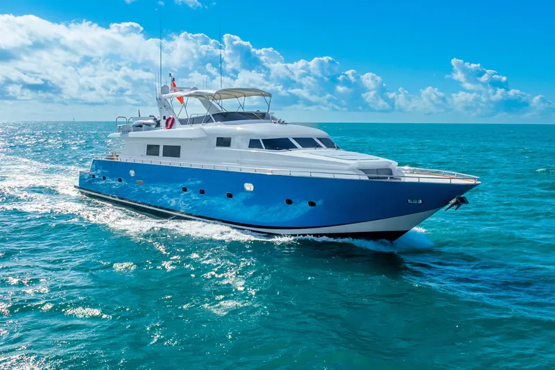 Slide: The Image of Luxurious 1991 Maiora Planning yacht cruising on clear blue ocean waters. - 27