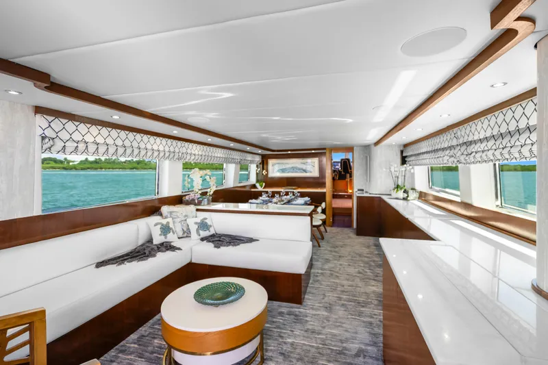 Slide: The Image of Luxurious interior of 1991 Maiora Planning yacht with elegant seating and panoramic windows. - 6