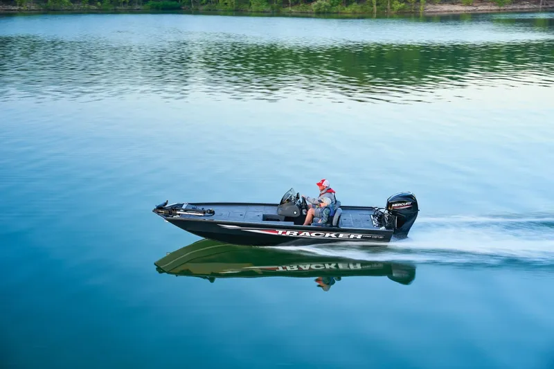 Slide: The Image of 2026 Tracker Pro 170 boat cruising on a serene lake. - 14