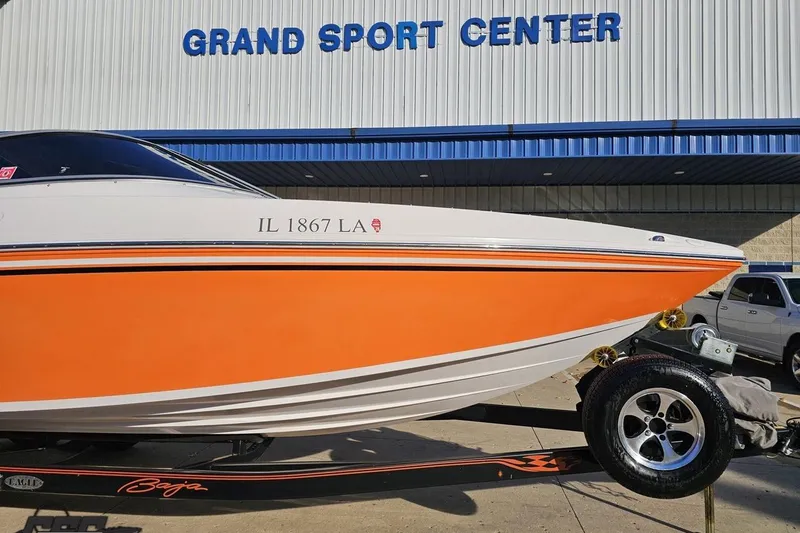 Slide: The Image of 2016 Baja 247 Islander boat with orange hull at Grand Sport Center. - 11
