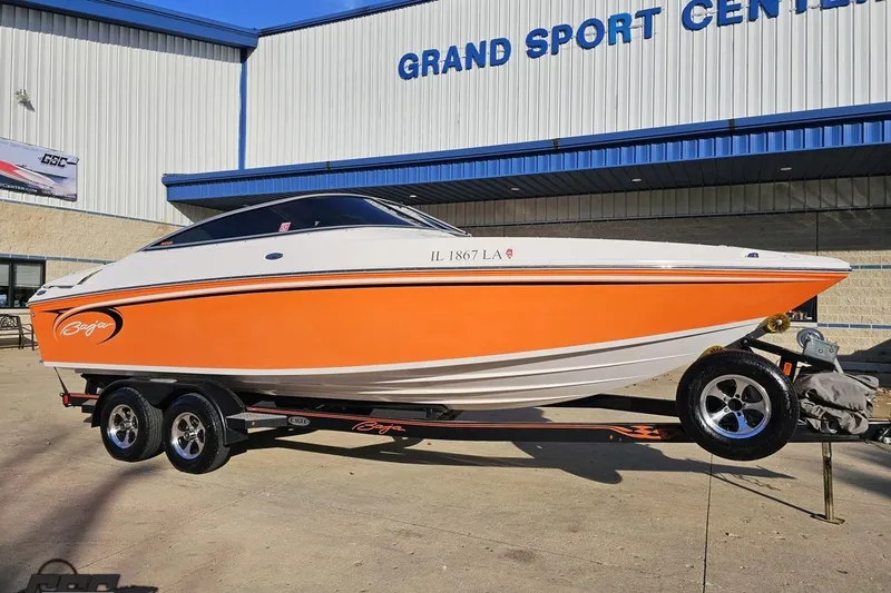 Slide: The Image of 2016 Baja 247 Islander boat in orange and white, parked at Grand Sport Center. - 12