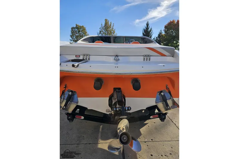 Slide: The Image of 2016 Baja 247 Islander boat rear view with orange and white design. - 29