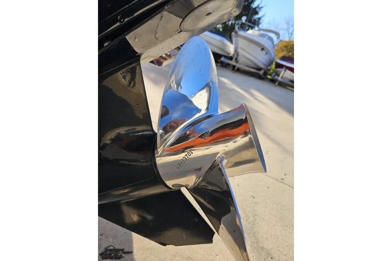 Slide: The Image of Close-up of a 2016 Baja 247 Islander boat propeller, shiny and metallic. - 31