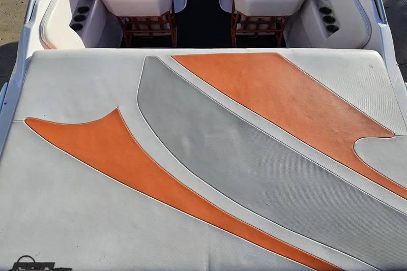 Slide: The Image of 2016 Baja 247 Islander boat interior with orange and gray upholstery design. - 38