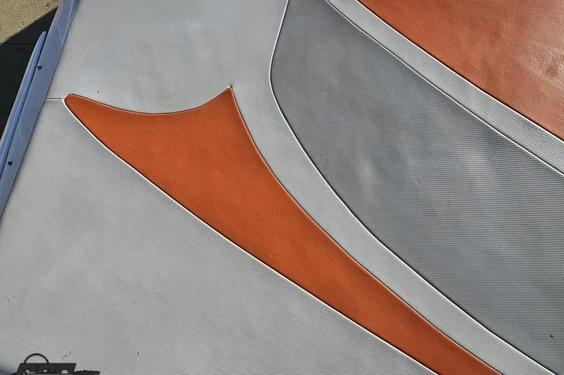 Slide: The Image of Close-up of 2016 Baja 247 Islander boat deck with orange and gray design. - 40