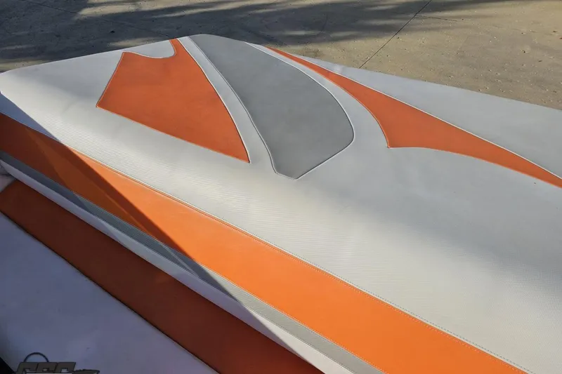 Slide: The Image of 2016 Baja 247 Islander boat with orange and gray upholstery design. - 48