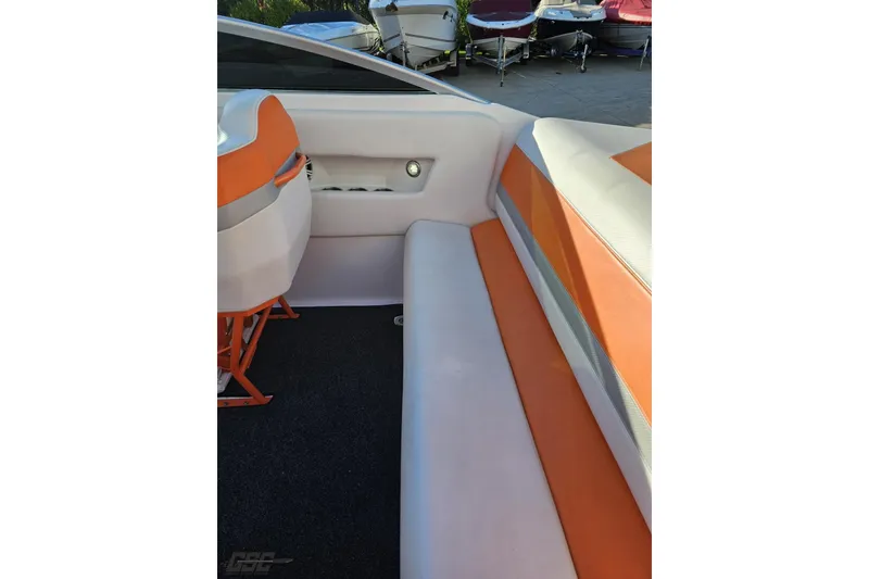 Slide: The Image of 2016 Baja 247 Islander boat interior with orange and white seating. - 49