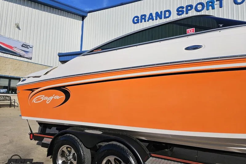 Slide: The Image of 2016 Baja 247 Islander boat with orange hull at Grand Sport Center. - 5