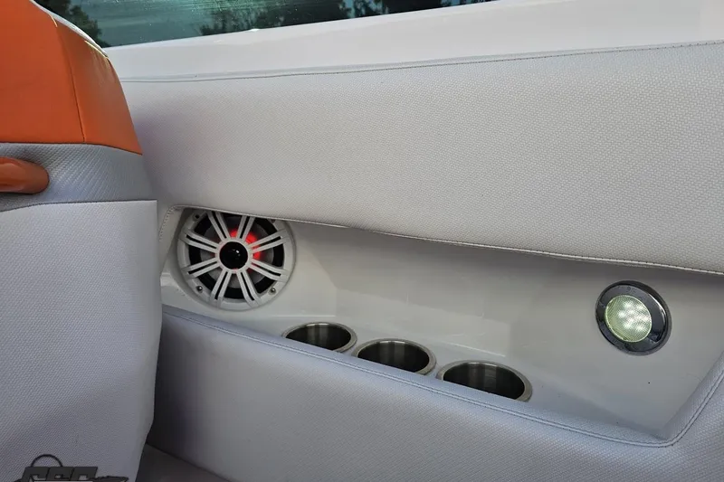 Slide: The Image of Interior of 2016 Baja 247 Islander boat with speaker, cup holders, and light. - 52