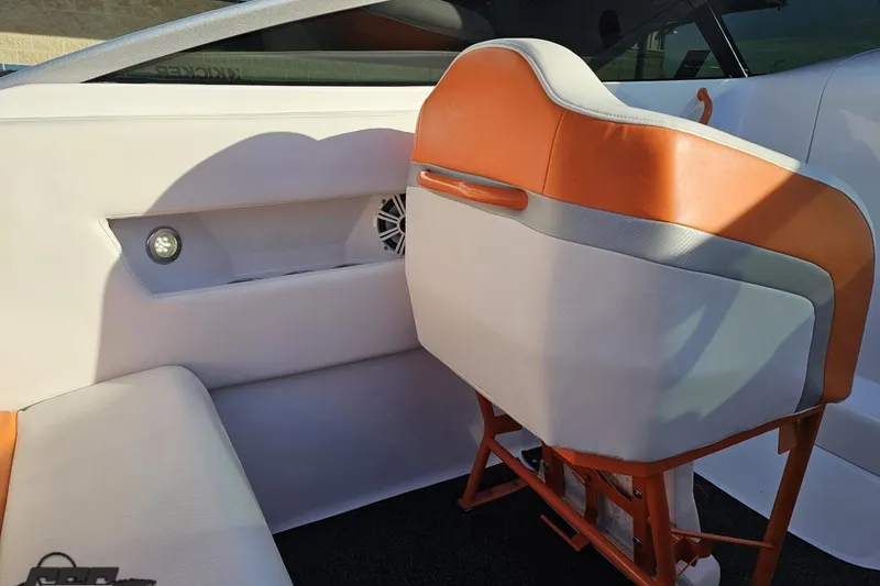Slide: The Image of Interior of 2016 Baja 247 Islander boat with orange and white seating. - 57