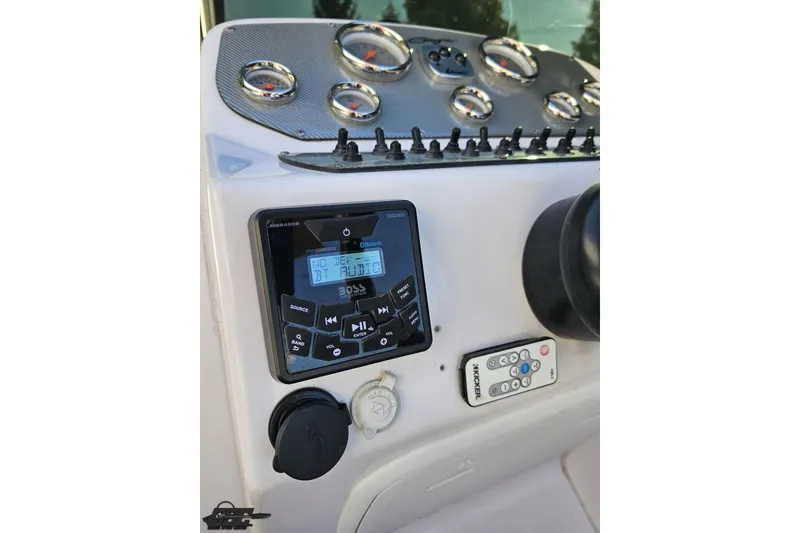 Slide: The Image of Control panel of 2016 Baja 247 Islander boat with audio system and gauges. - 65