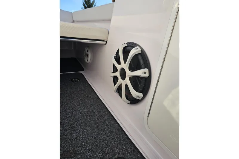 Slide: The Image of Speaker system on 2016 Baja 247 Islander boat, featuring sleek white interior design. - 70