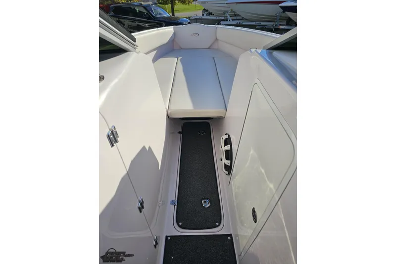 Slide: The Image of 2016 Baja 247 Islander boat interior with seating and storage compartments. - 74
