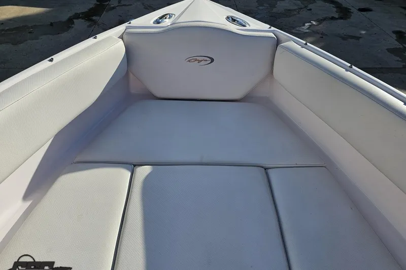 Slide: The Image of 2016 Baja 247 Islander boat interior with white cushioned seating. - 76