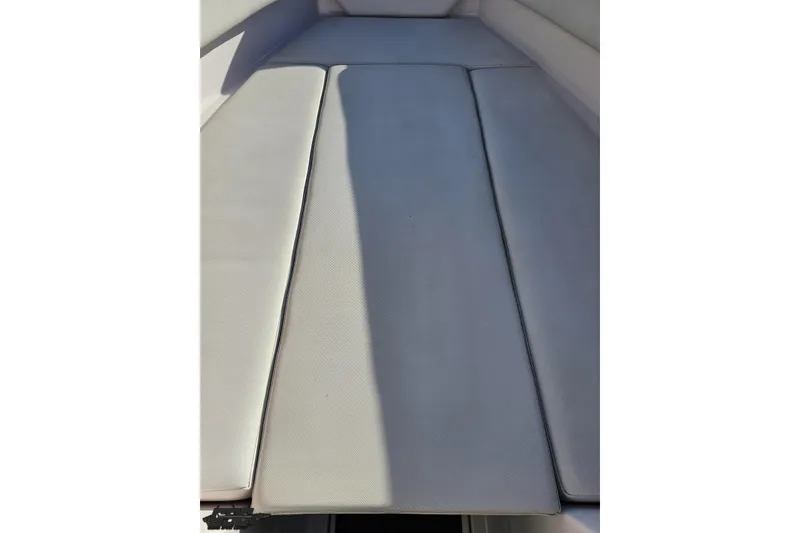 Slide: The Image of 2016 Baja 247 Islander boat interior with cushioned seating area. - 79