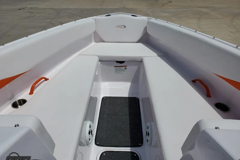 Slide: The Image of 2016 Baja 247 Islander boat interior with white seating and orange accents. - 82