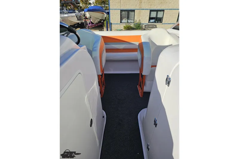 Slide: The Image of 2016 Baja 247 Islander boat interior with white and orange seating. - 84