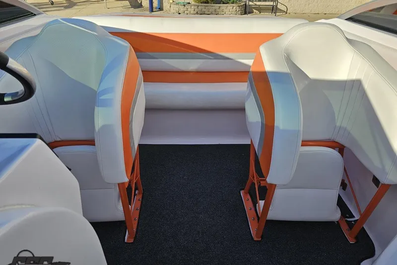 Slide: The Image of 2016 Baja 247 Islander boat interior with orange and white seating. - 85