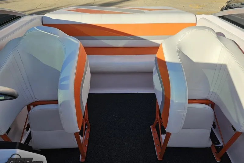 Slide: The Image of 2016 Baja 247 Islander boat interior with orange and white seating. - 86