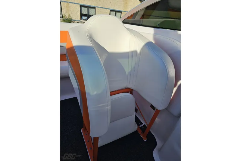 Slide: The Image of 2016 Baja 247 Islander boat seat with white and orange upholstery. - 88