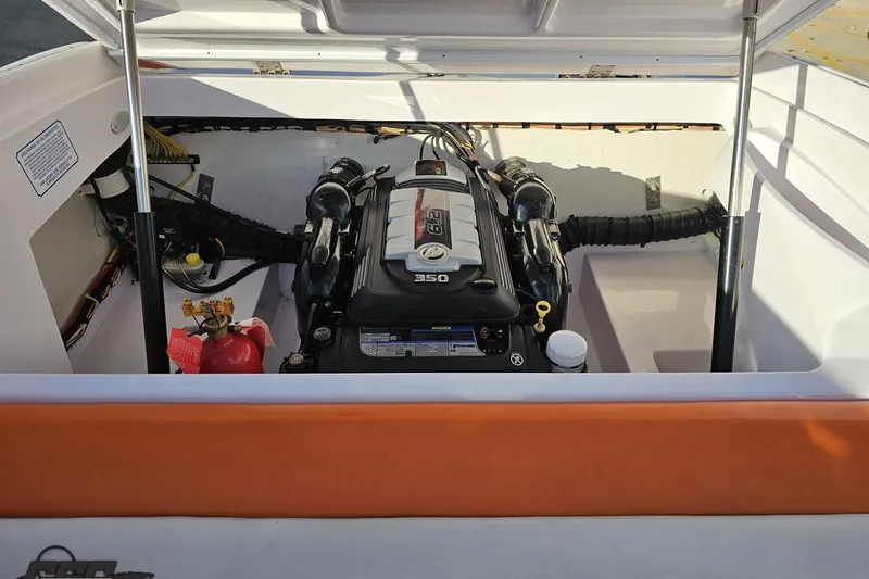 Slide: The Image of 2016 Baja 247 Islander boat engine compartment with visible 350 engine. - 94