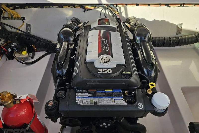 Slide: The Image of Engine of 2016 Baja 247 Islander boat, featuring a Mercury 6.2L 350 horsepower motor. - 99