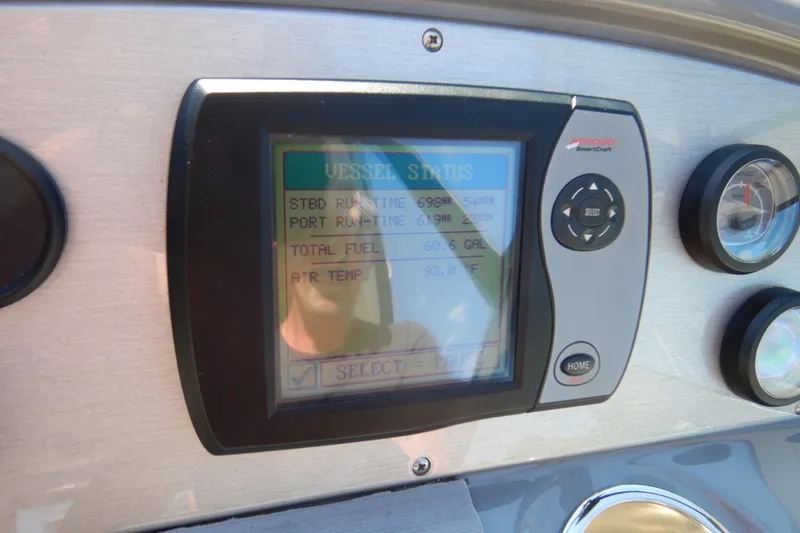 Slide: The Image of 2007 Cruisers 340 Express boat interior with teak flooring and white seating. - 18