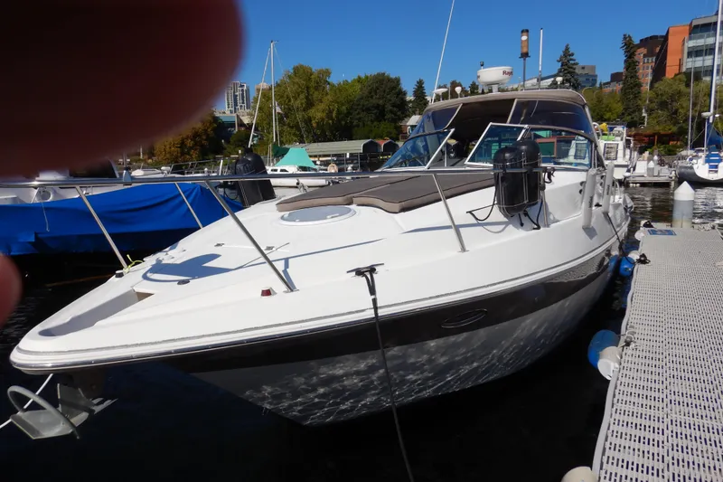 Slide: The Image of 2007 Cruisers 340 Express yacht docked at marina, side view. - 2