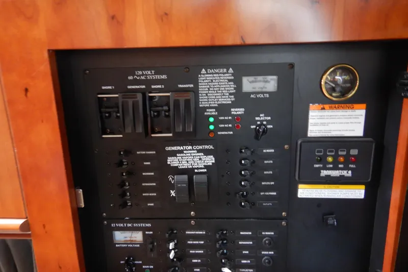 Slide: The Image of 2007 Cruisers 340 Express yacht interior with curved beige seating and wooden accents. - 35