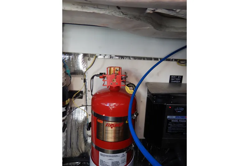 Slide: The Image of 2007 Cruisers 340 Express engine compartment with Mercury 8.1 engines and detailed components. - 42