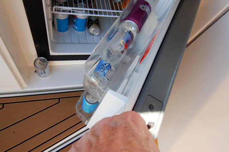 Slide: The Image of Luxurious 2007 Cruisers 340 Express yacht interior with white seating and wooden flooring. - 8