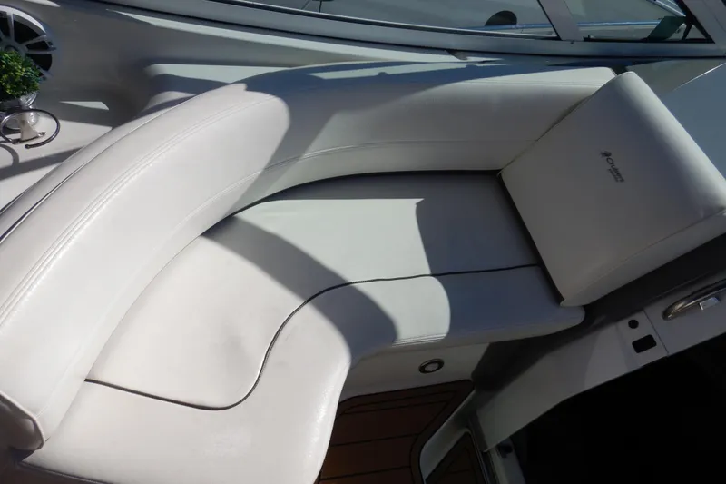 Slide: The Image of Open mini fridge on 2007 Cruisers 340 Express boat with teak flooring. - 11