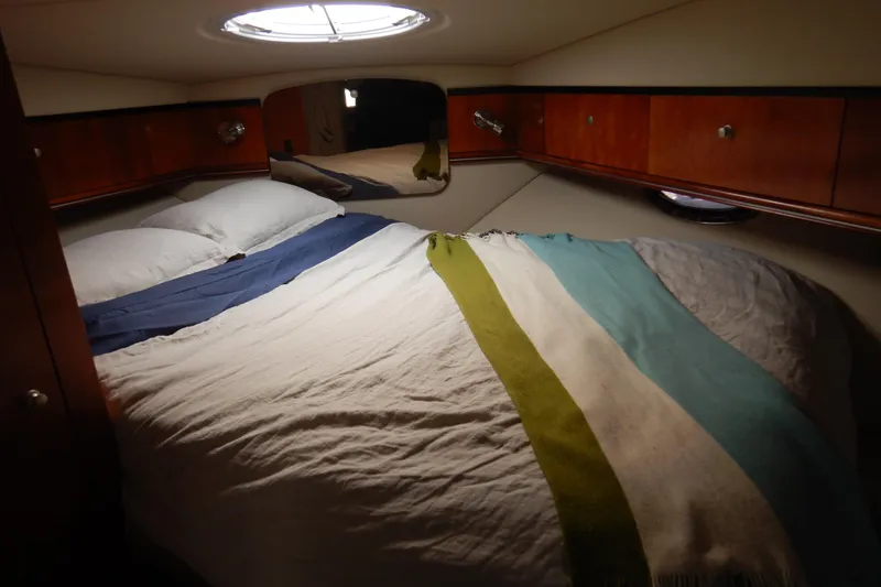 Slide: The Image of 2007 Cruisers 340 Express yacht kitchen with modern appliances and wooden cabinetry. - 25